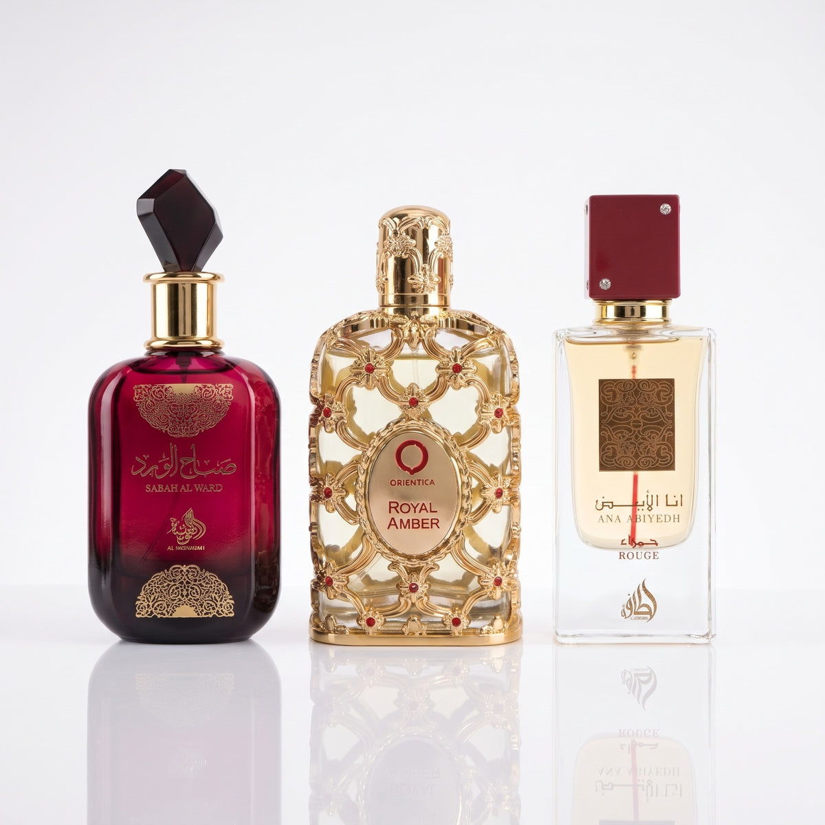 Frascos originais de Sabah Al Ward, Royal Amber e Ana Abiyedh Rouge, fragrâncias que compõem o combo Samadi de três decants de 5ml