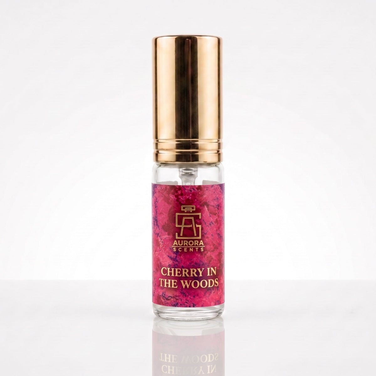 Decant físico de Cherry in the Woods Aurora Scents, rótulo rosa e tampa dourada
