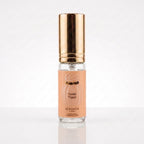 Decant de Maison Asrar Vanilla Voyage EDP em frasco transparente com tampa dourada