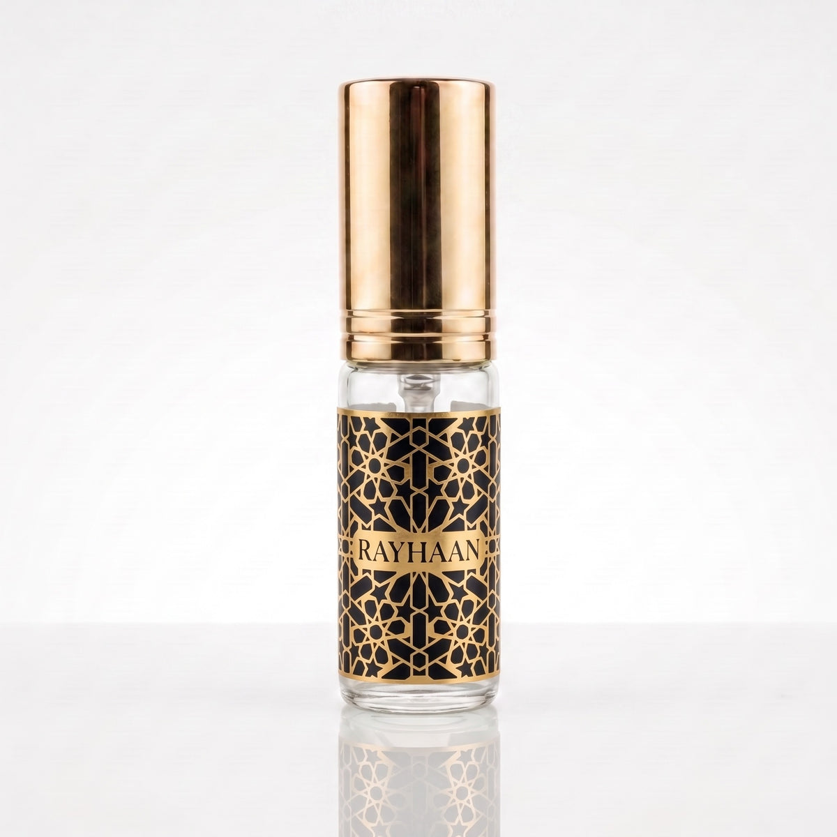 Decant do perfume Rayhaan Elixir EDP masculino em frasco transparente com tampa dourada
