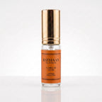 Decant Rayhaan Corium com borrifador dourado, etiqueta caramelo e corpo em vidro