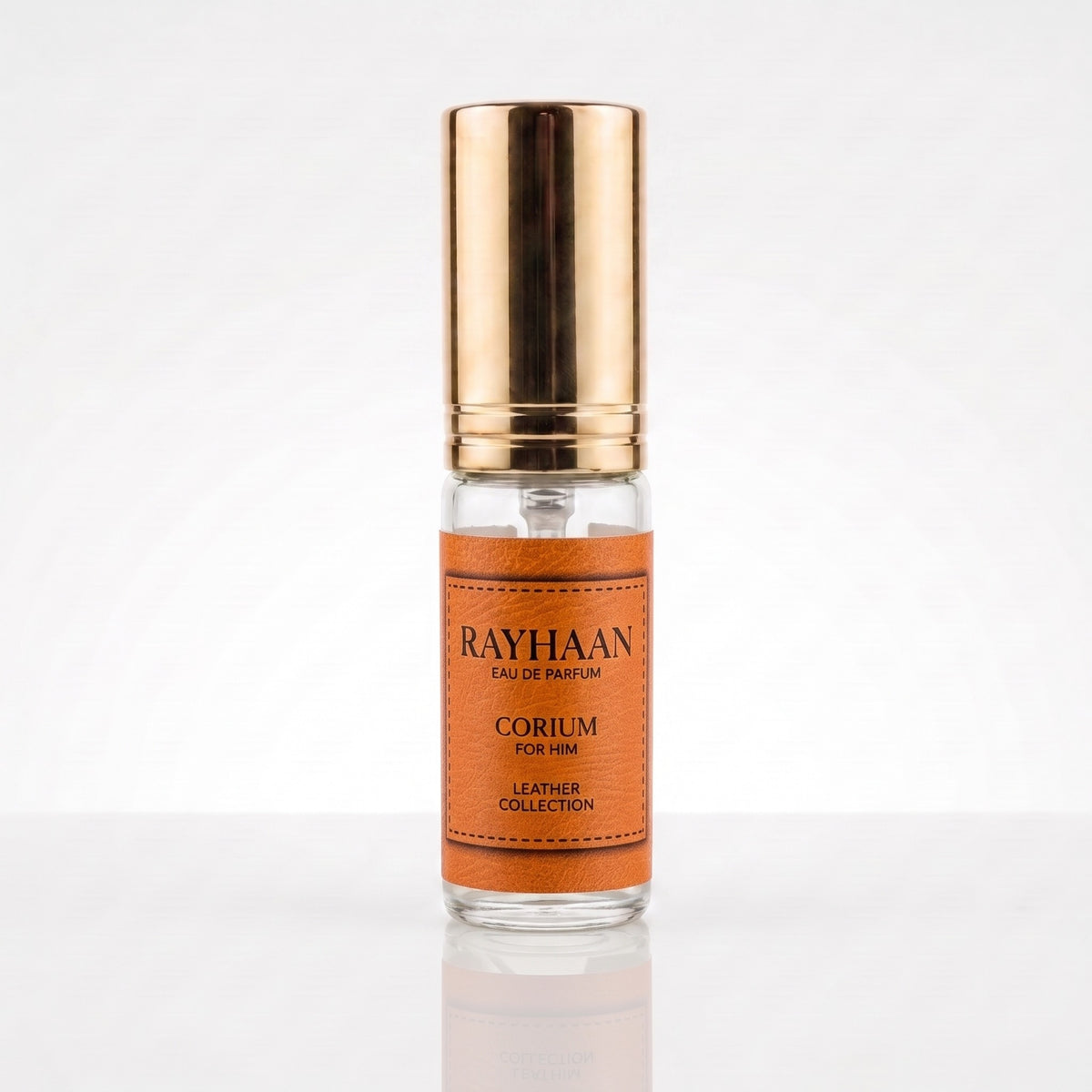 Decant Rayhaan Corium com borrifador dourado, etiqueta caramelo e corpo em vidro